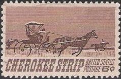 Brown and black 6-cent U.S. postage stamp picturing horses and carriage