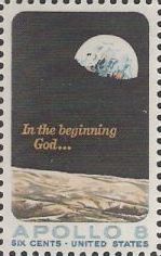 6-cent U.S. postage stamp picturing moon, Earth, and words 'In the beginning God...'