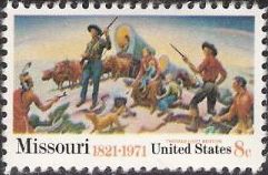 8-cent U.S. postage stamp picturing wagon train, settlers, and Native Americans