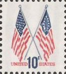 Blue and red 10-cent U.S. postage stamp picturing 50- and 13-star American flags