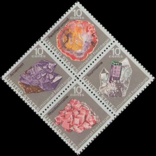 Block of four 10-cent U.S. postage stamps picturing petrified wood, amethyst, tourmaline, and rhodochrosite
