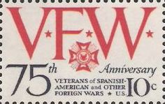 Red and black 10-cent U.S. postage stamp bearing letters 'VFW'
