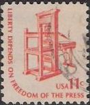 Orange 11-cent U.S. postage stamp picturing printing press