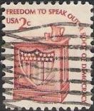 Brick red 2-cent U.S. postage stamp picturing speaker's stand