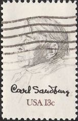 Black & brown 13-cent U.S. postage stamp picturing Carl Sandburg