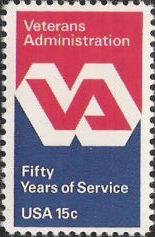 Red & blue 15-cent U.S. postage stamp picturing Veterans Administration logo
