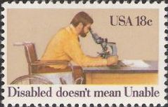 18-cent U.S. postage stamp picturing man in wheelchair using microscope