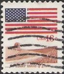 18-cent U.S. postage stamp picturing American flag over wheat field