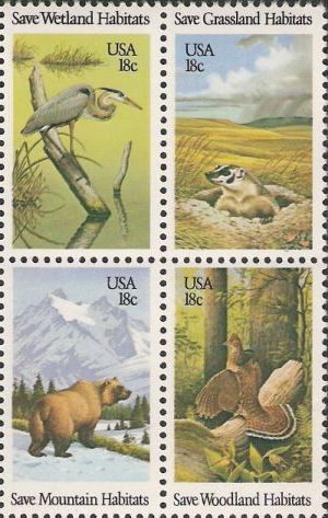 Block of four 18-cent U.S. postage stamps picturing heron, badger, bear, and grouse