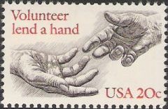 Black & red 20-cent U.S. postage stamp picturing hands