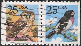 Pair of 25-cent U.S. postage stamps picturing owl and grosbeak
