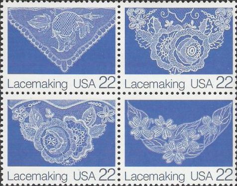 Block of four blue 22-cent U.S. postage stamps picturing lace
