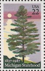 22-cent U.S. postage stamp picturing pine tree and lake