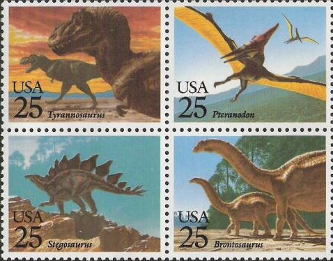 Block of four 25-cent U.S. postage stamps picturing dinosaurs