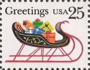 25-cent U.S. postage stamp picturing sleigh full of presents