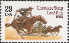 Cherokee Strip 29-cent U.S. postage stamp picturing settlers with horses and carriages
