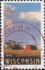32-cent U.S. postage stamp picturing barn and field