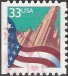 33-cent U.S. postage stamp picturing American flag and buildings