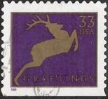 Purple & gold 33-cent U.S. postage stamp picturing deer