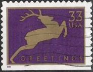 Purple & gold 33-cent U.S. postage stamp picturing deer