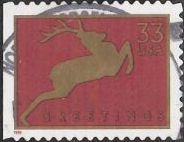 Red & gold 33-cent U.S. postage stamp picturing deer