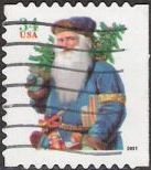 34-cent U.S. postage stamp picturing Santa Claus holding tree and horn