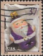 37-cent U.S. postage stamp picturing purple Santa Claus Christmas ornament
