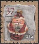 37-cent U.S. postage stamp picturing red Santa Claus Christmas ornament