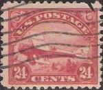 Red 24-cent U.S. postage stamp picturing DeHavilland Biplane