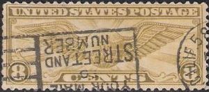 Olive 8-cent U.S. postage stamp picturing winged globe