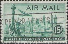 Green 15-cent U.S. postage stamp picturing airplane over Statue of Liberty and New York City