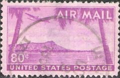 Pink 80-cent U.S. postage stamp picturing airplane over Diamond Head, Hawaii