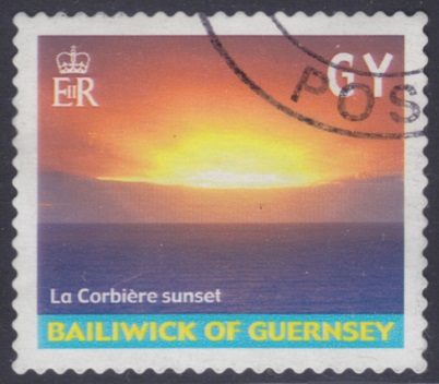 Non-denominated Guernsey postage stamp picturing sunset at La Corbiere