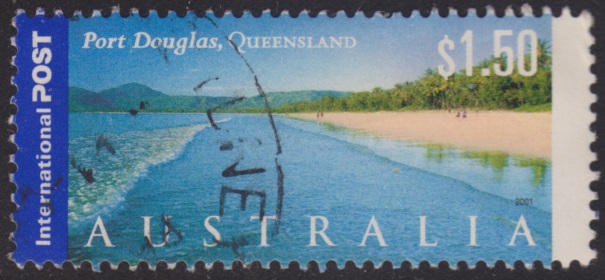 $1.50 Australian postage stamp picturing Four Mile Beach in Queensland